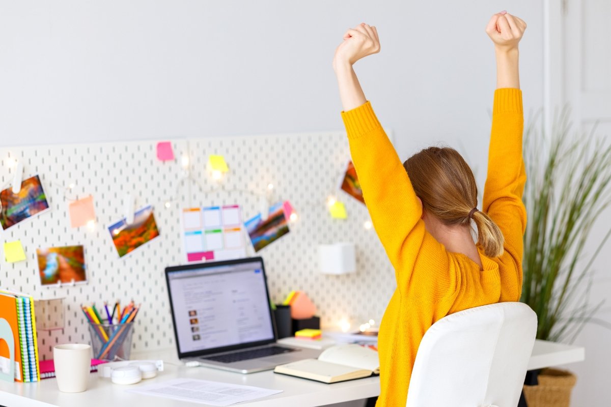 A woman celebrating her first page ranking on Google.