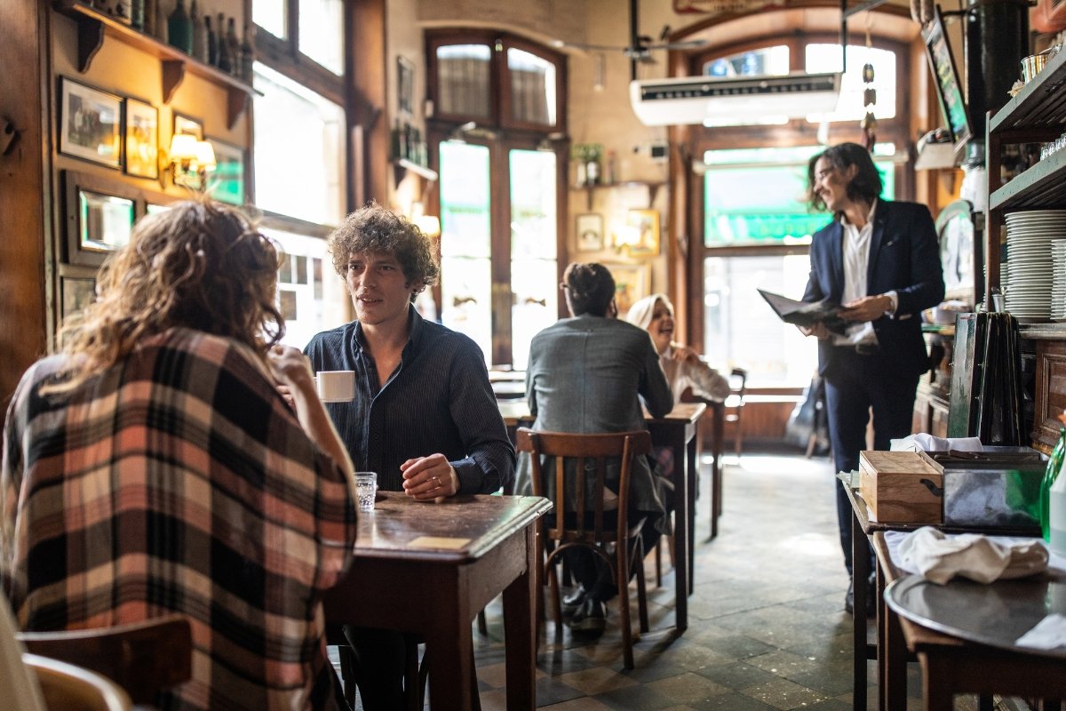 A group of people enjoying a meal in a local restaurant they found by using local seo tips.
