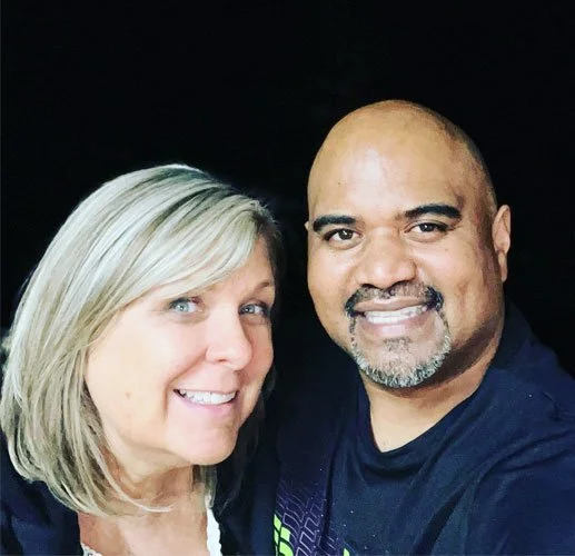 A couple taking a selfie at night, showcasing their affiliation with a digital marketing company.