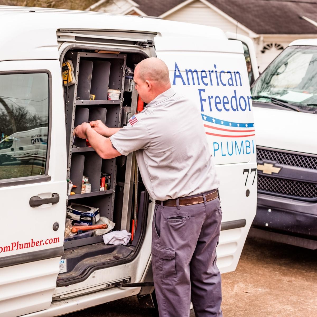 A man is opening a van door for local services ads.