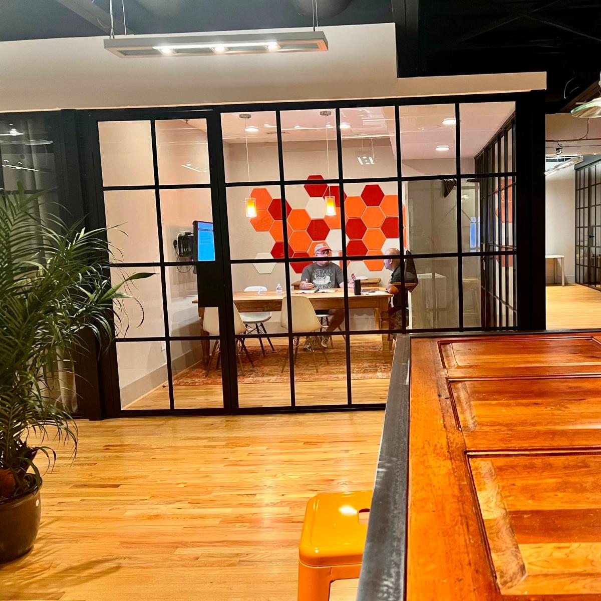 An office with a wooden table and chairs enhanced by Smyrna web design.