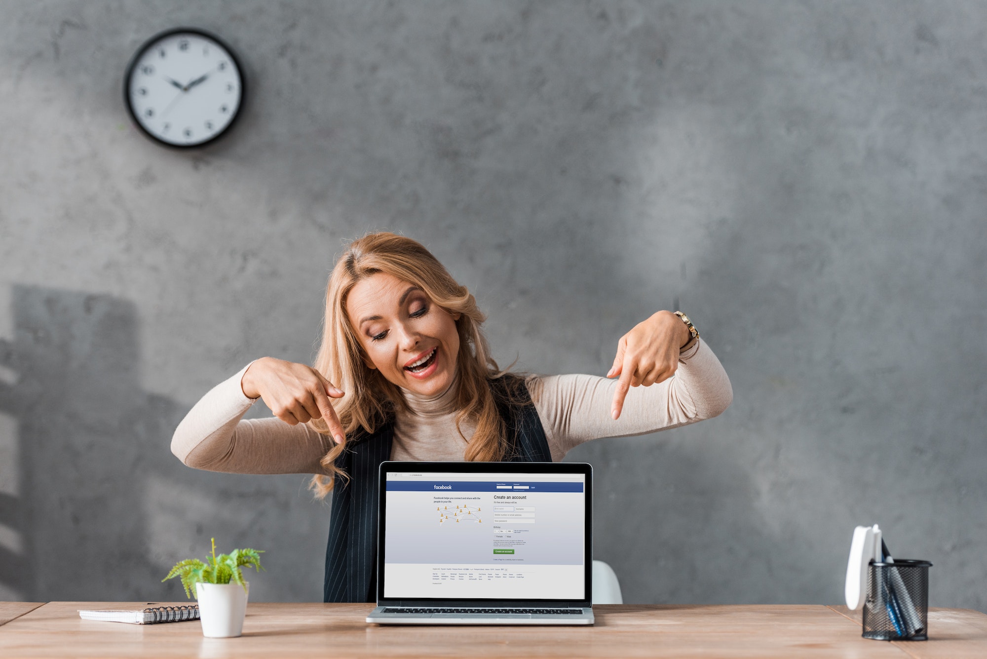 Kyiv Ukraine August 16 2019 Smiling Businesswoman Pointing With Fingers At Laptop Facebook 14 Essential Tips On How To Improve Your Facebook Page