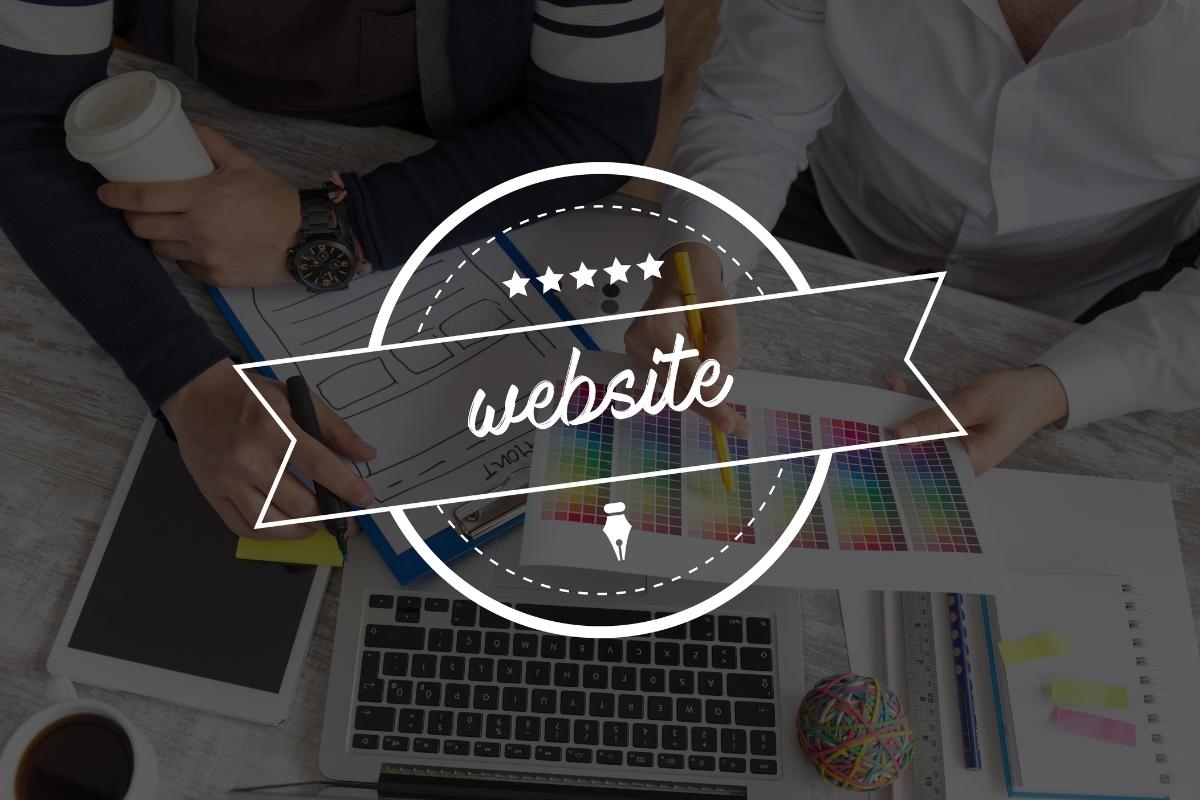 Two individuals collaborating on a website project.