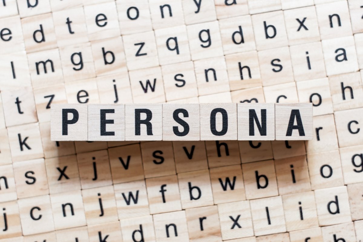 A wooden block spells out "customer personas
