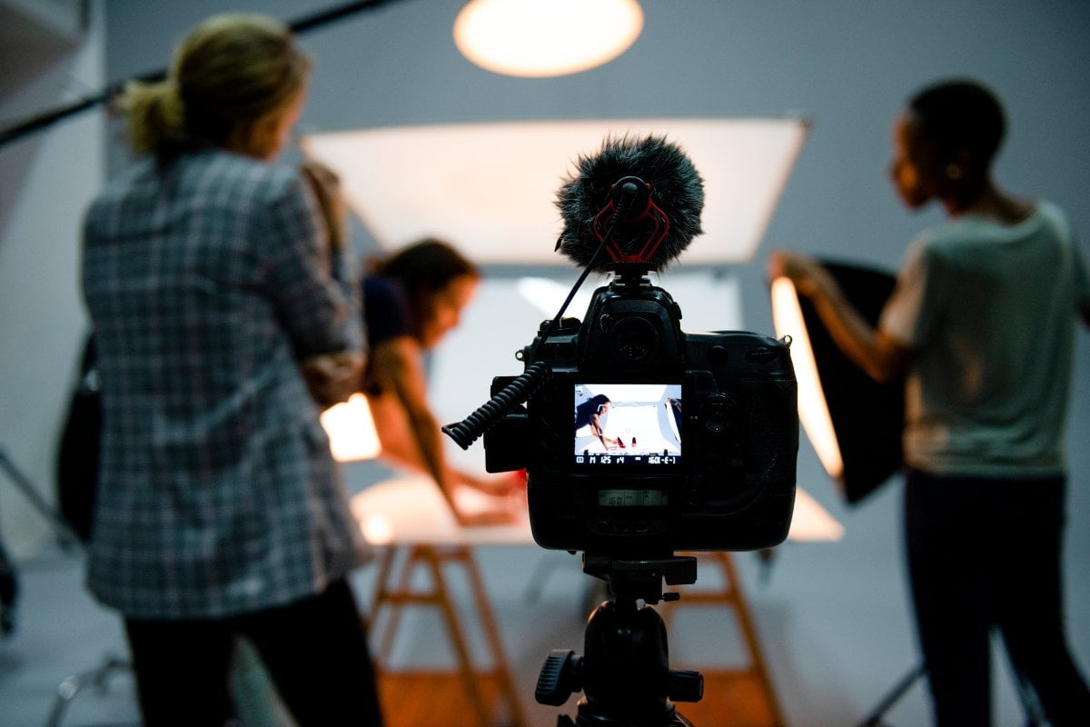 A group of people posing for branding photography in a studio.
