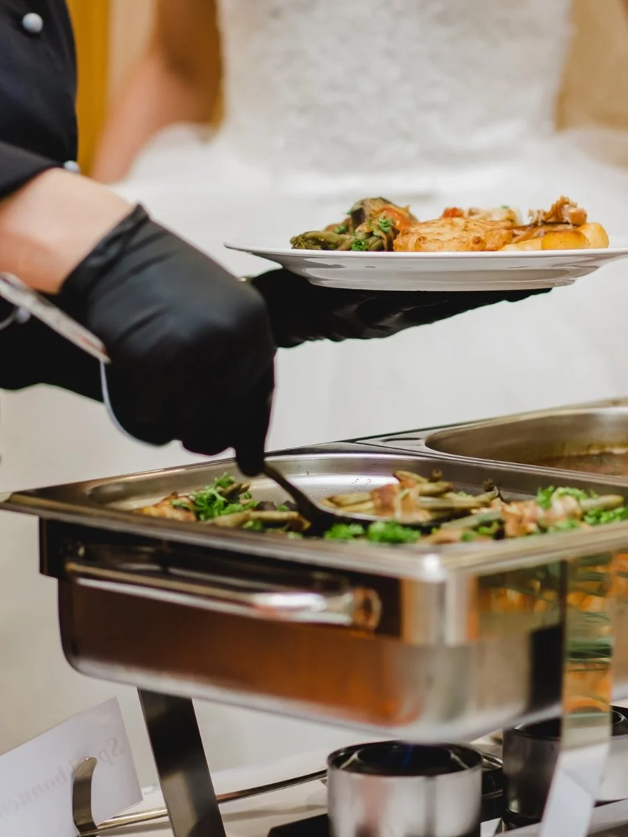 A couple offering buffet catering services.