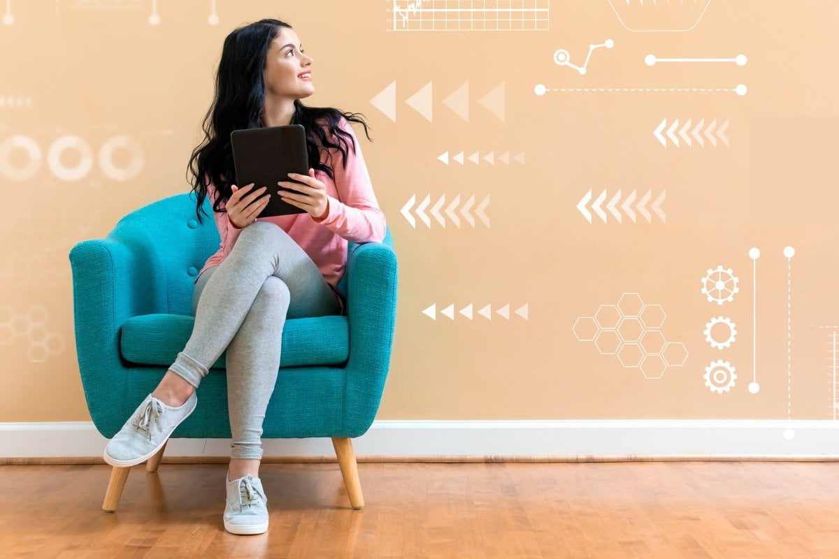 A young woman utilizing a tablet computer for automated lead generation.