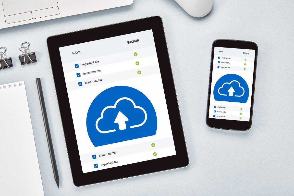 A tablet and phone featuring a cloud icon for easy WordPress backups.