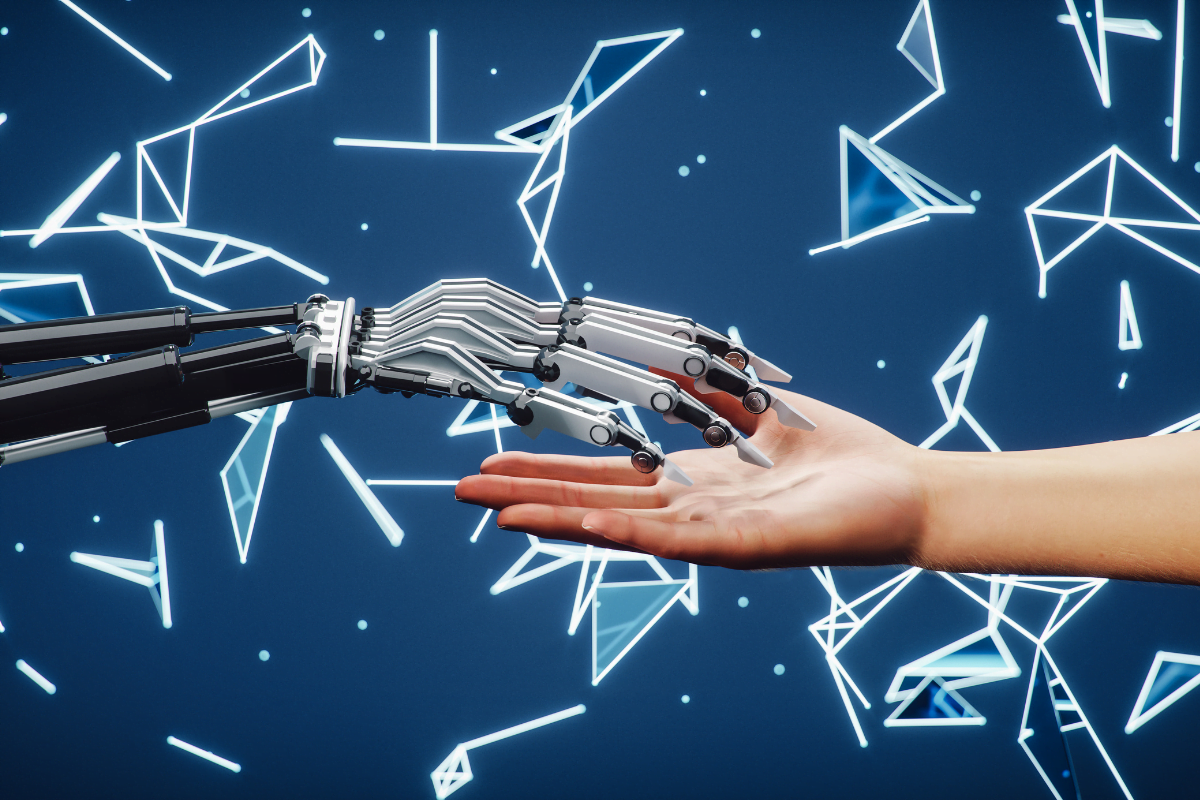 AI In Marketing: Revolutionizing Strategies For Success 4 A robot hand extending towards a human hand, demonstrating the application of AI in marketing.