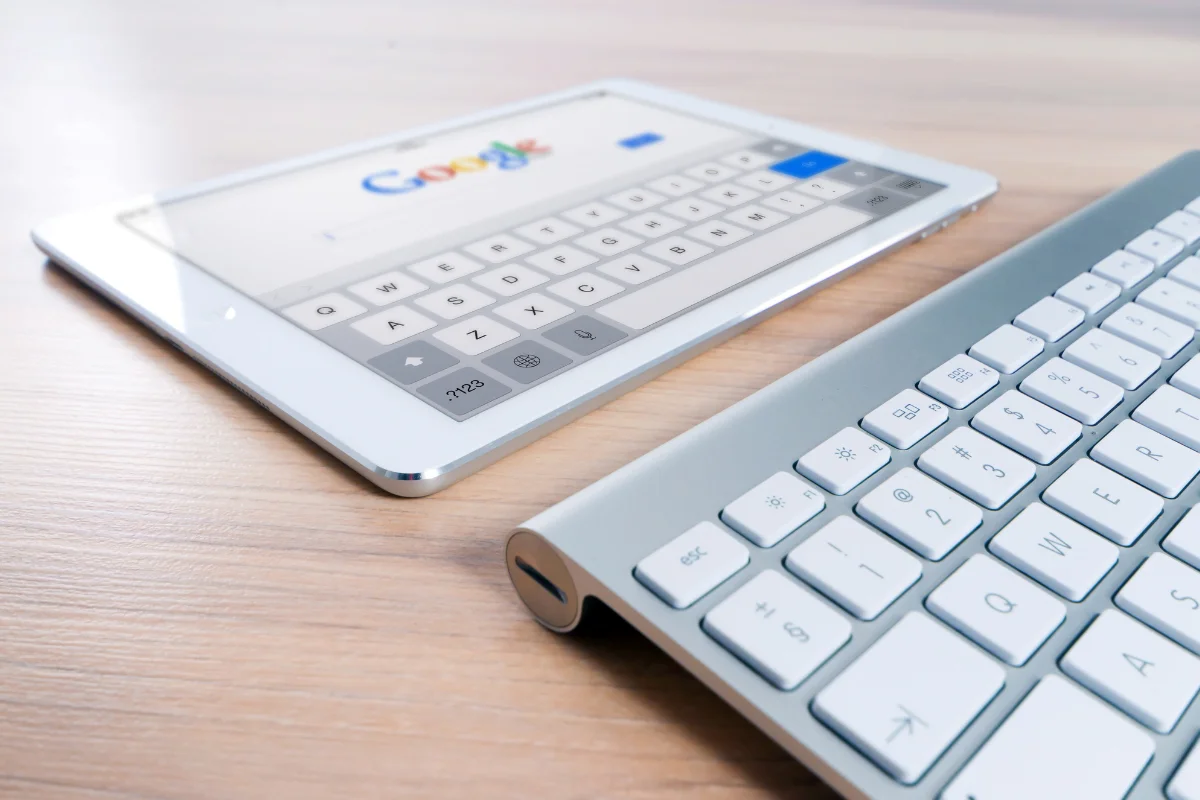 Google Answer Box: A Game-Changer In Search 2 A tablet with a keyboard on a table displaying Google search.
