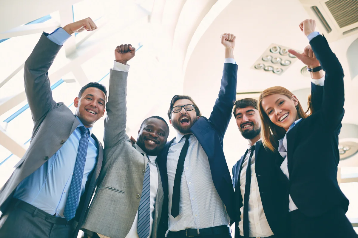 Google Answer Box: A Game-Changer In Search 4 A group of business people celebrating with raised fists in the air.