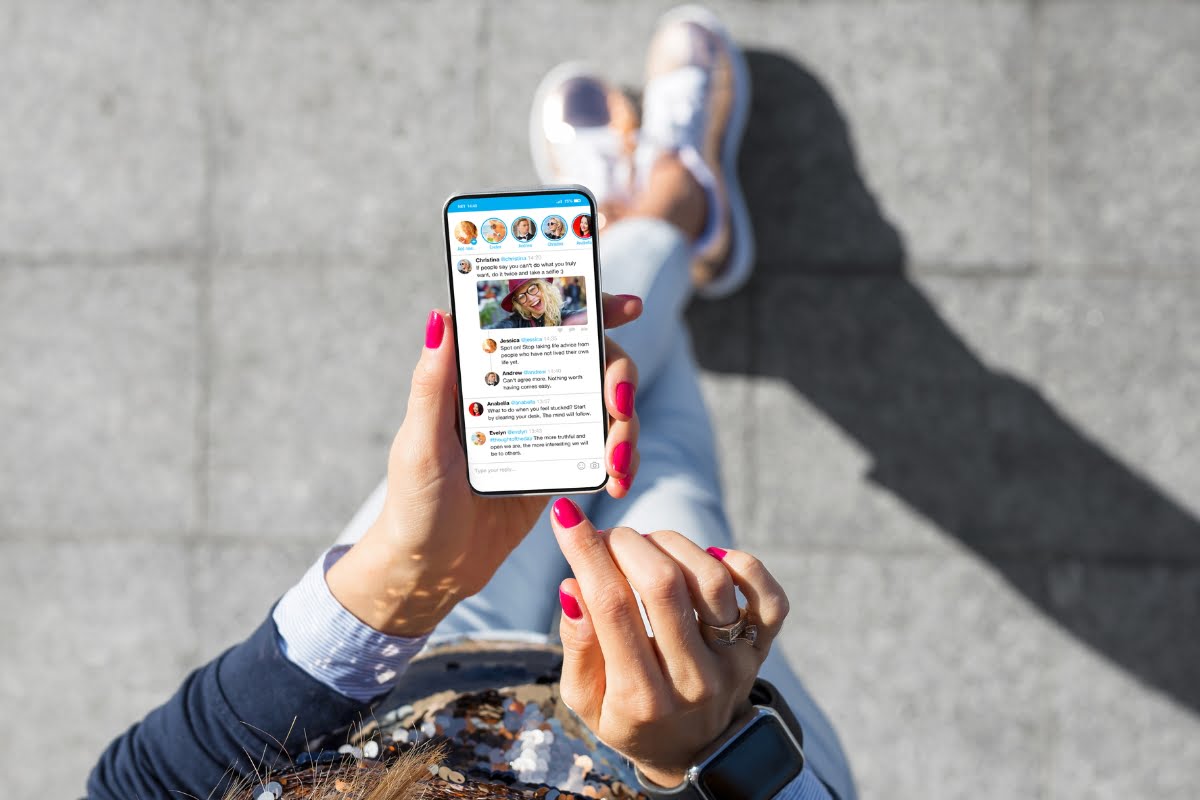 Shadow Banning on Social Media 6 A woman holding a smartphone with shadow banning.
