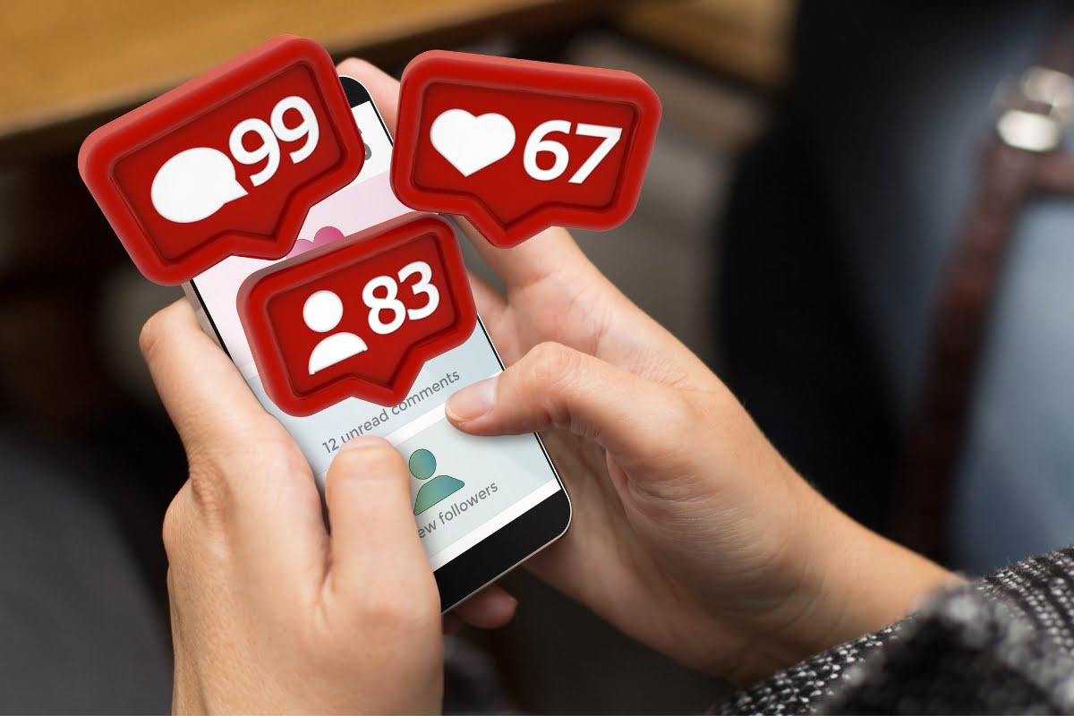 Shadow Banning on Social Media 8 A person holding a cell phone with icons on it.