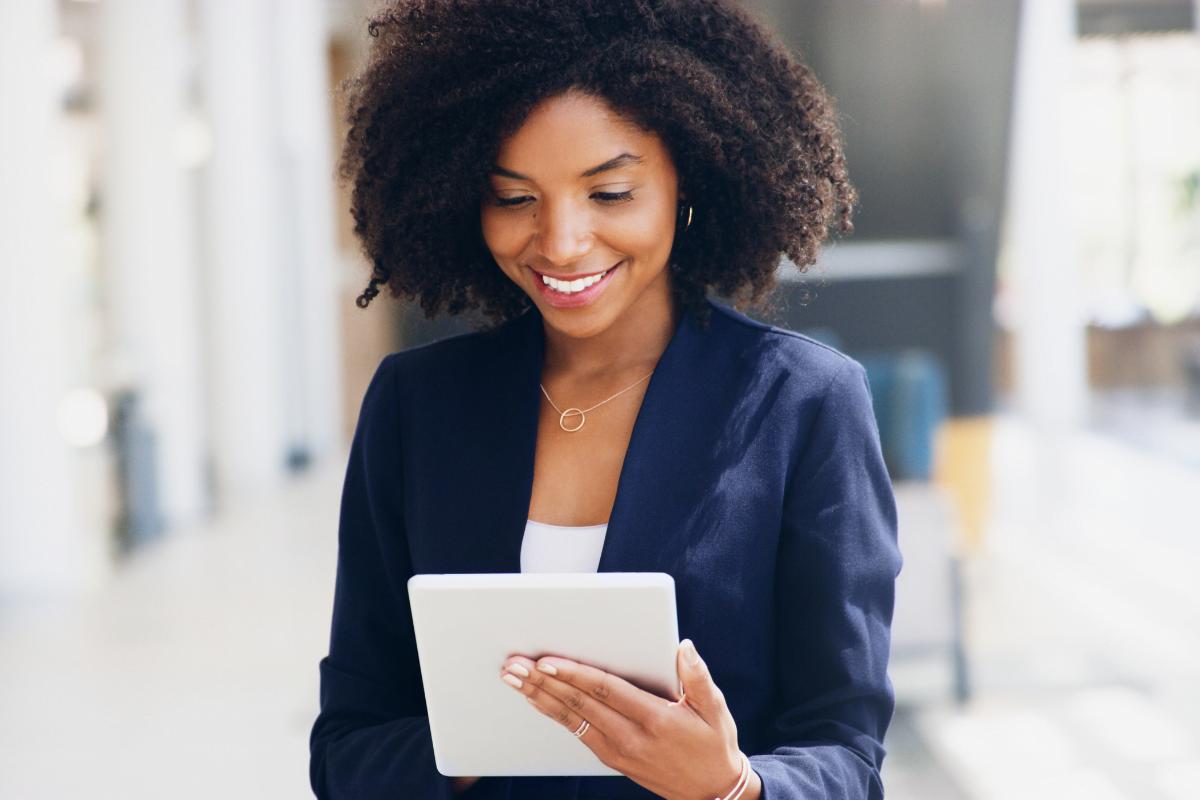 Get Noticed: GMB Services For Business Growth 3 A woman using a tablet to showcase her products on Google My Business.