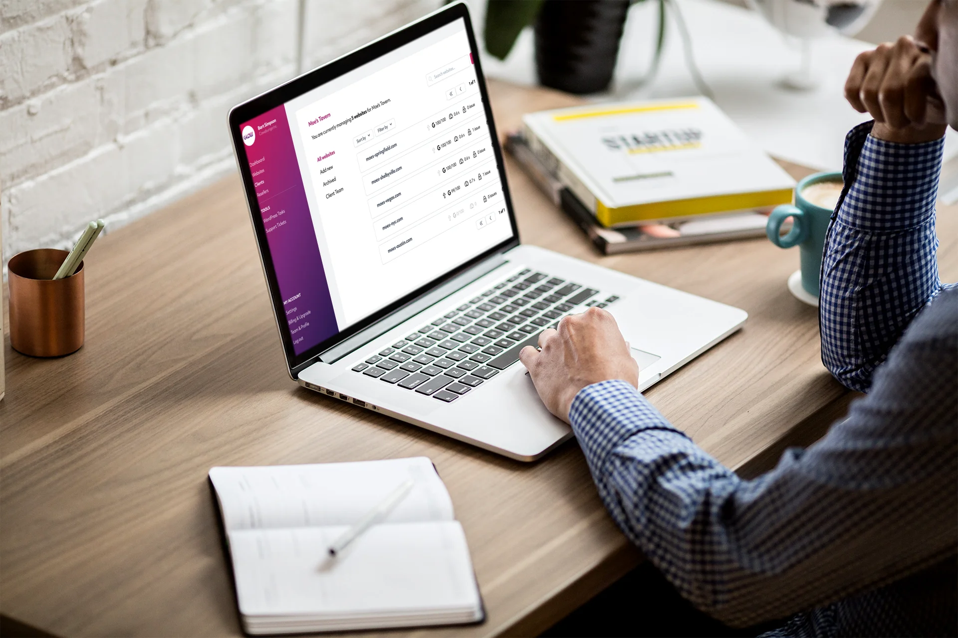 3 Pillars of Effective Website Maintenance 3 A man maintaining multiple WordPress websites and providing effective website maintenance and support at a desk with a laptop.