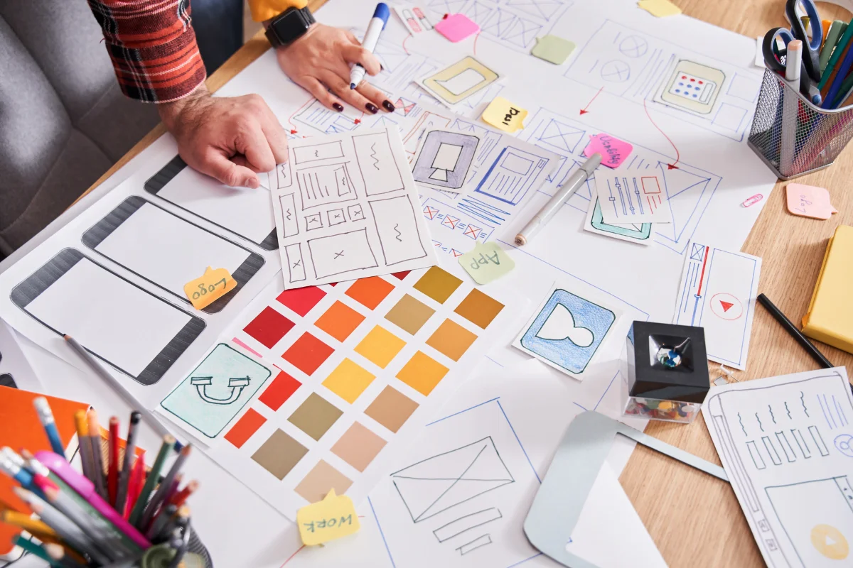 Website Color Schemes That Speak Volumes About Your Brand 1 A group of people working on a website design project.