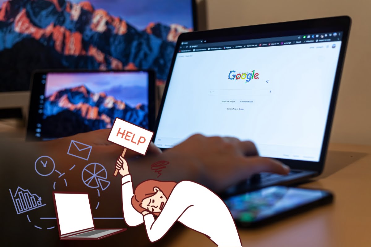 A person is sitting at a desk, working on reinstating their Google Business profile. They have their laptop and phone on the desk.