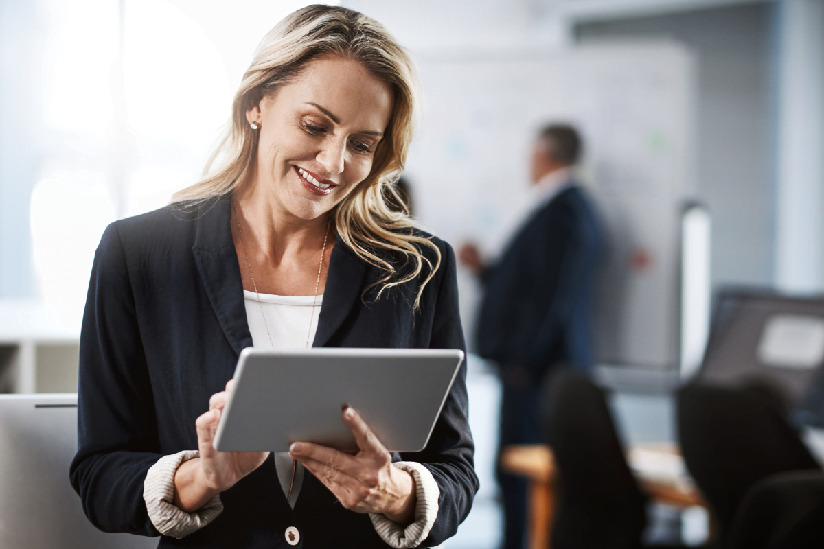 A lawyer using a tablet in an office.
