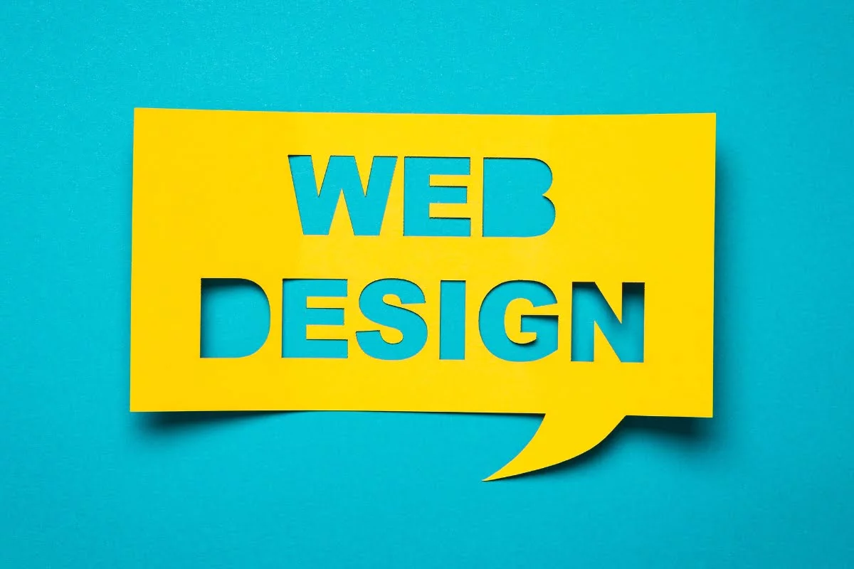Redesigning a Website: Revamp Your Site for Better SEO 3 A yellow speech bubble with the word web design on it, perfect for redesigning a website.