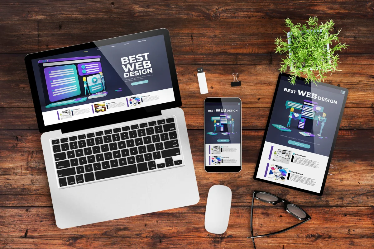 What Are WordPress Themes And How They Transform Websites 2 A laptop, tablet and smartphone on a wooden table showcasing various WordPress themes.