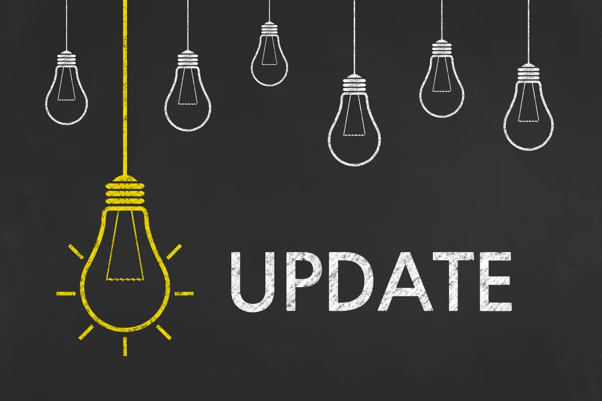 Mobilegeddon: The Day That Changed Mobile Optimization Forever 2 Light bulbs with the word "update" drawn on a blackboard, symbolizing the importance of staying current in a fast-paced world.