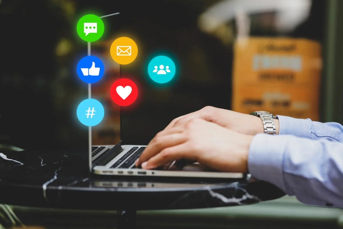 Social Media Copy: Master the Art of Writing Engaging Online Content 1 a person writing social media copy on their laptop, resulting in likes and CTAs