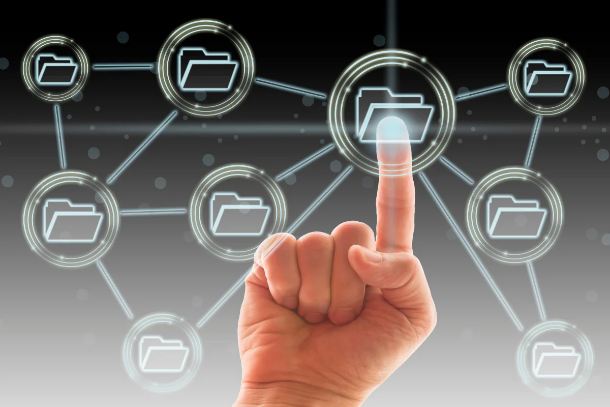 WordPress Website Migration Checklist For A Seamless Transition 3 A hand pointing on a folder, signifying a website migration checklist for moving files to another server.