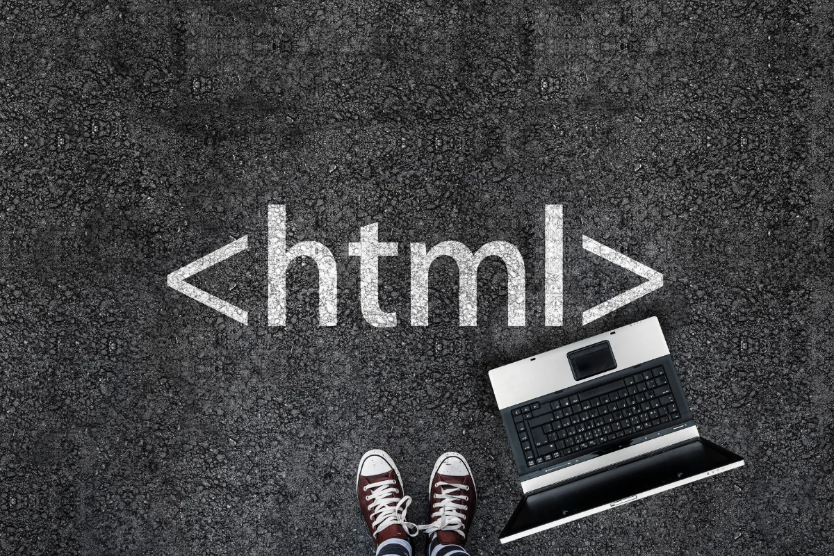 A laptop with the word HTML written on it is a component of a website.