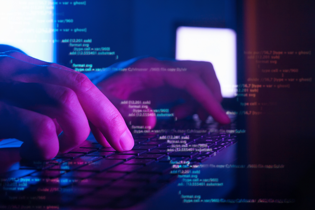 What Is A Website: Unveiling The Magic Behind Online Platforms 3 A person typing on a computer keyboard at night, building a website.