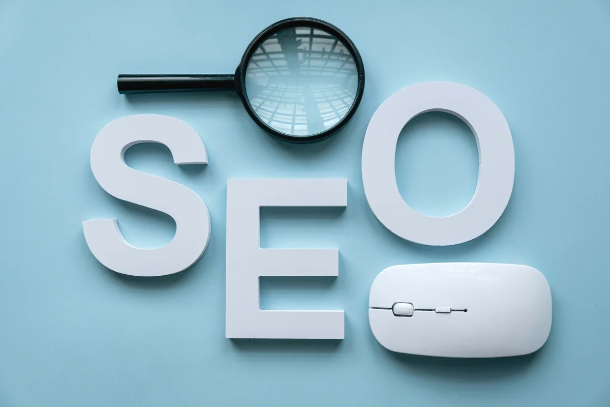 E-E-A-T in SEO: Unraveling the Secret Sauce of Online Success 2 The word seo, surrounded by a magnifying glass and a mouse, illustrating the importance of E-E-A-T in SEO.