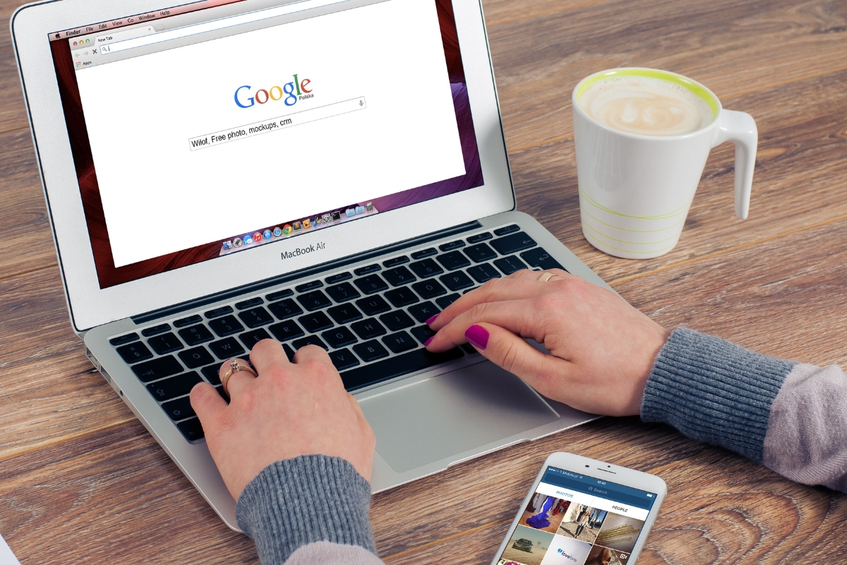 Google Search Console: Mastering Your Website's Performance Metrics 1 A woman typing on a laptop with Google Search Console on the screen.