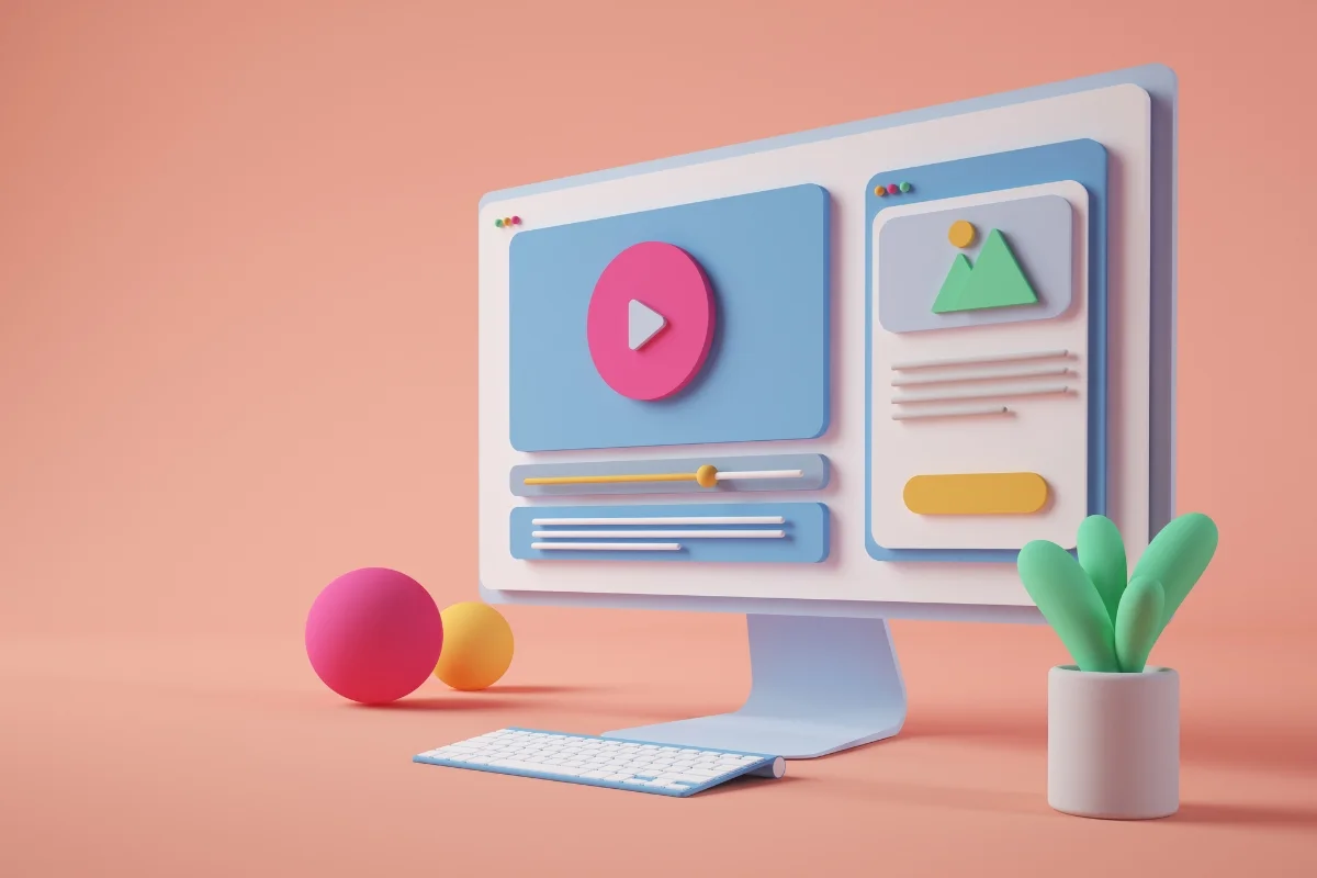 Plumbing Automation: Boost Customer Engagement Effortlessly 7 A computer monitor with colorful 3D shapes on the screen sits on a peach-colored desk. Nearby are two spherical objects and a small potted plant, subtly hinting at the seamless integration of plumbing automation in this modern workspace.
