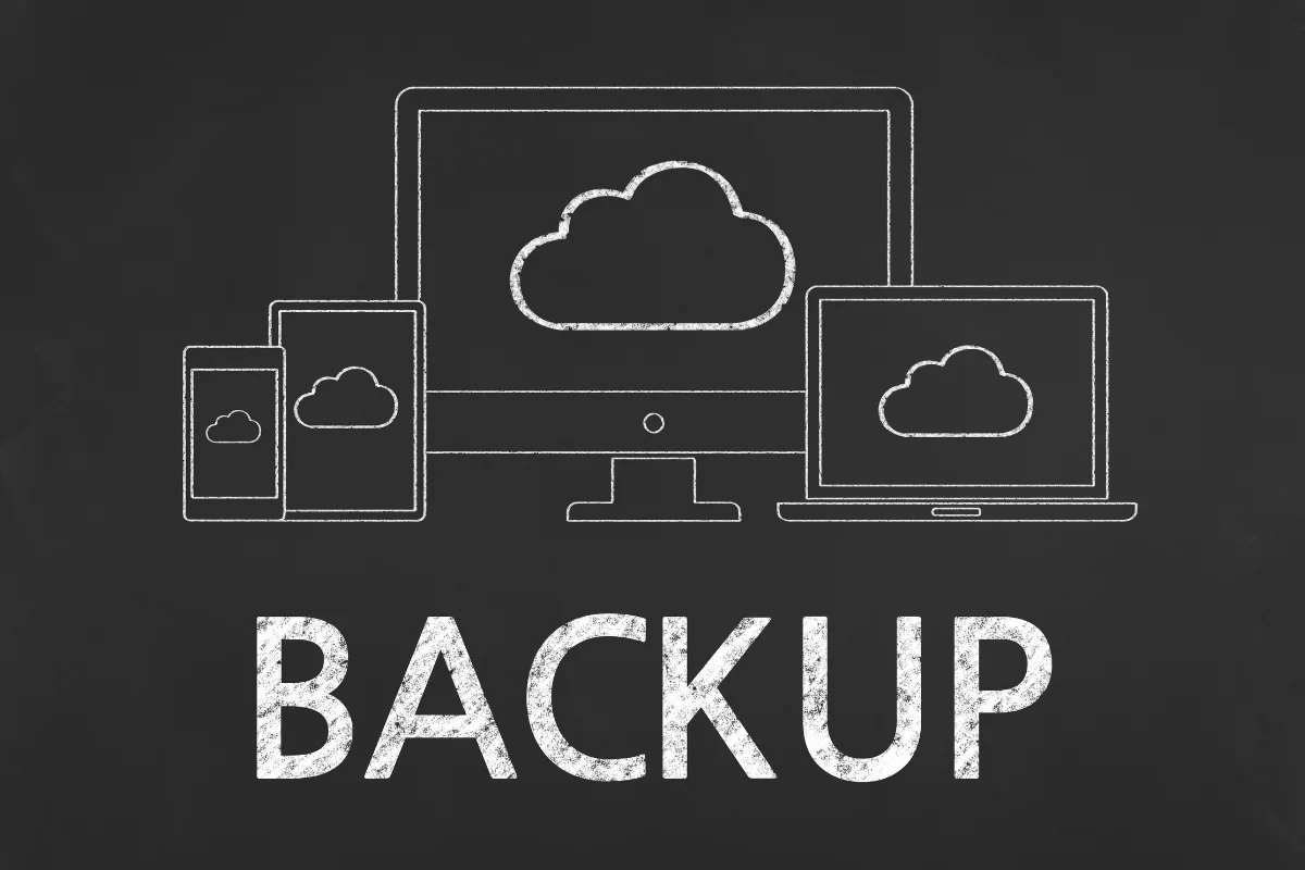 Illustration of electronic devices (desktop, laptop, tablet, and smartphone) with cloud icons on screens above the word "BACKUP" on a chalkboard-like background, emphasizing Off-Site WordPress Backups for enhanced Website Security.