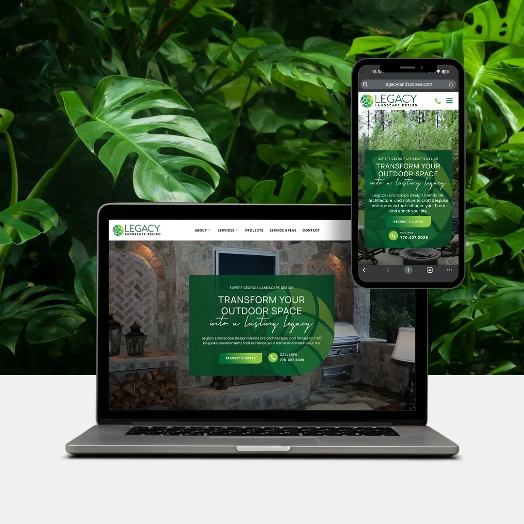 A laptop and smartphone display the Legacy Landscape Design website homepage, set in front of lush green foliage.