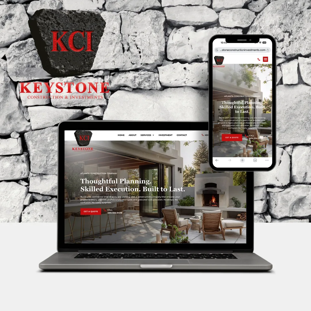 A laptop and smartphone display the Keystone Investments website, featuring the company&rsquo;s logo and a stone wall backdrop behind the devices.