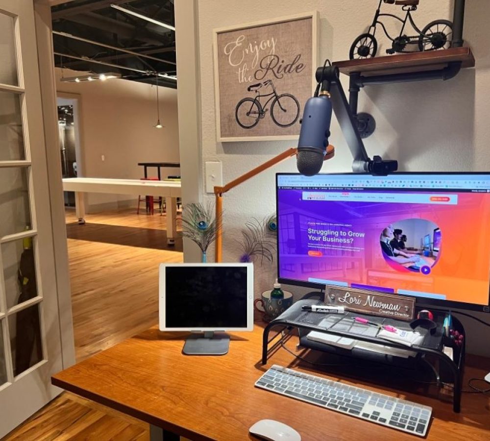 A digital marketing and logo company providing woocommerce hosting services on a computer and bicycle on the desk.